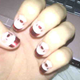 Illustration for article titled Fists Pumpin And Christmas-Themed Acrylic Nails